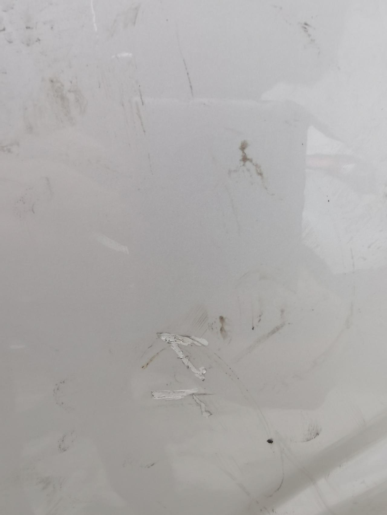 沃尔沃XC60 这种怎么修复 不知道咋弄的 左后车门上有个这种形状的  4s修复大概多少钱