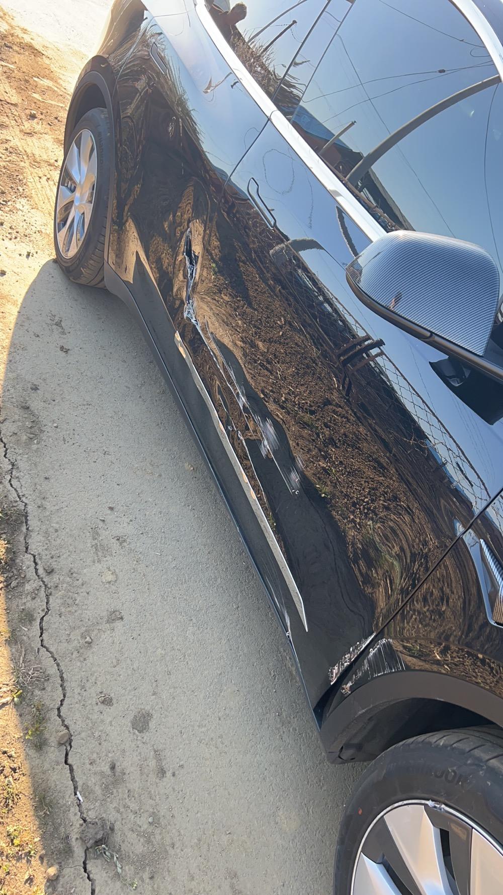 特斯拉Model Y 我去年12月提的y长划了，问了需要换两个门和下面保护板，请问卖能卖多少 其他啥问题没有 让农作物刮